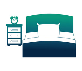 hotel bed and bedside table clock alarm