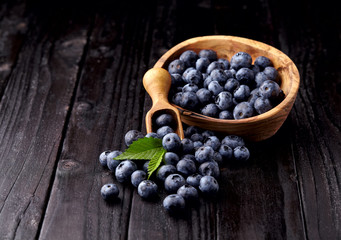 blueberries on black  wooden background