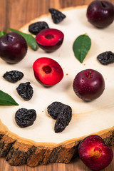 Dried Plums Pitted Prunes and Fresh Plums Background. Selective focus.