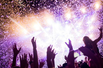 Portrait of happy crowd enjoying at music festival