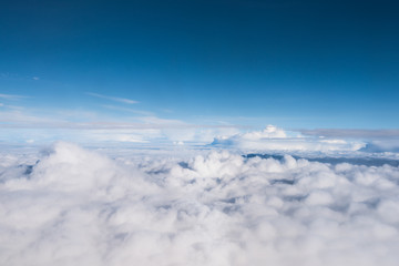 Naklejka na ściany i meble cloud and blue sky view from window of airplane
