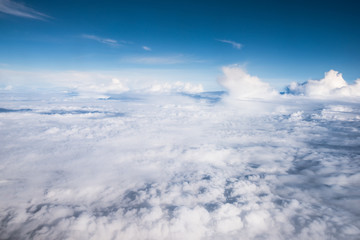 Fototapeta na wymiar cloud and blue sky view from window of airplane