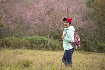 Asian woman stand among Pink flower King of tigers