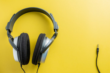 Stereo Headphones on Yellow background. copy space for text.