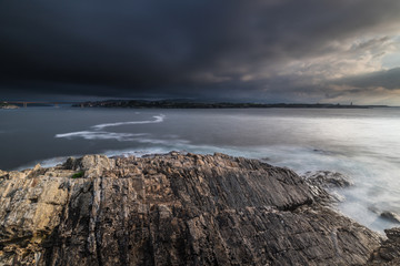 The rocky coast of the Cantabrian Sea with its clouds, sun and reflections!