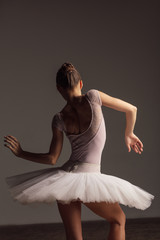 Young beautiful ballerina is posing in studio © Alexander Y