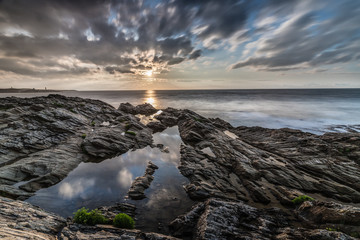 The rocky coast of the Cantabrian Sea with its clouds, sun and reflections!