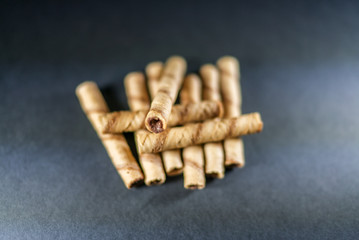 delicious cream filled wafers on the black background