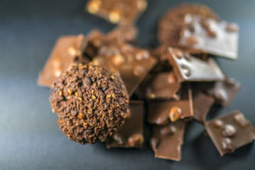 hazelnut milk chocolate and diet cocoa, hazelnut cookies and delicious cream filled wafers on the black background