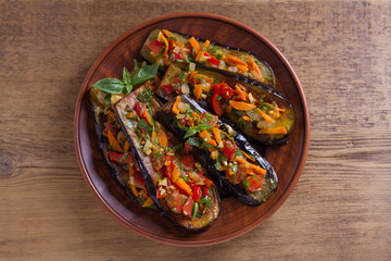 Pan fried eggplants with tomatoes, paprika, carrot, onion and garlic. View from above, top studio shot