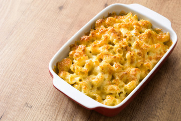Typical American macaroni and cheese on wooden table