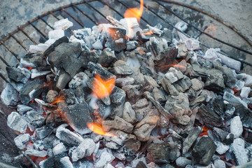 Charcoal burning in a barbeque ready to cook.