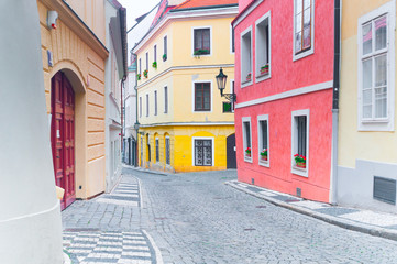 Empty narrow cobblestone street in downtown in Prague, Czech Republic