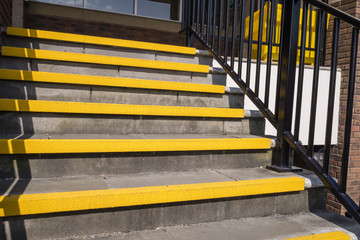Yellow safety step edges on an outside staircase