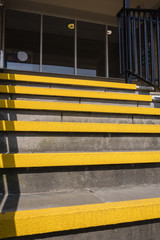 Fototapeta premium Yellow safety step edges on an outside staircase