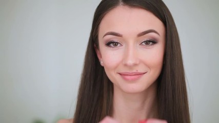 Beauty Face Care. The Portrait of Young Woman With a Daily Makeup Closes and Opens Her Eyes