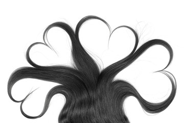 Black hair in shape of heart isolated on a white background
