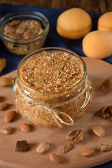 Urbech of apricot kernel in a glass jar. National Dagestani paste of nuts
