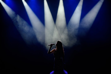 Singer in silhouette