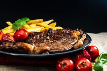 juicy steak beef meat with tomato and french fries