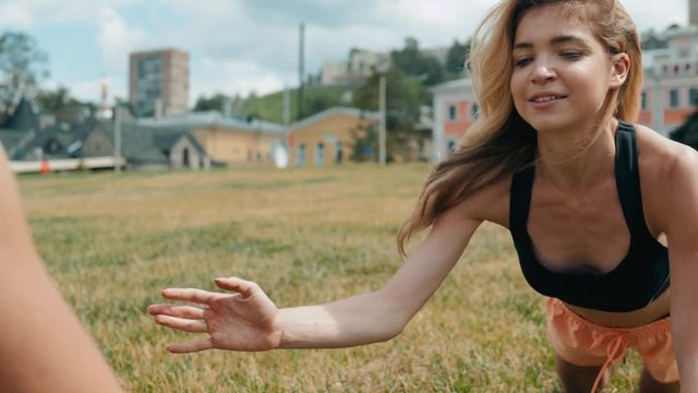 fitness, sport, training, park and lifestyle concept - smiling woman doing doing push-ups on mat outdoors happy friends smiling training close up