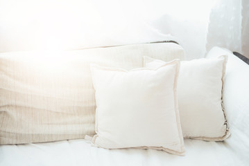 Fototapeta na wymiar White pillow on sofa in living room.