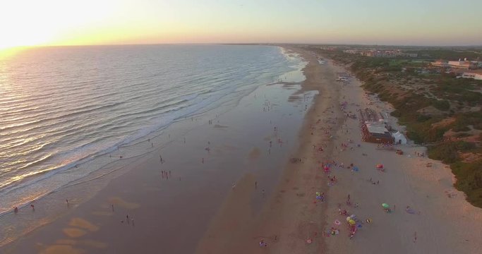 Aerial - Beatiful beach with sun umbrellas and beach restaurant