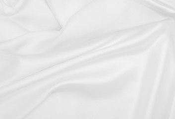 Smooth elegant white silk or satin luxury cloth texture as wedding background. Luxurious background design