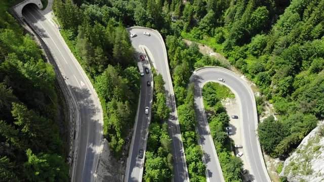 curved road with cars and beautiful forest landscape. Bicaz gorges, Romania. Aerial view from drone