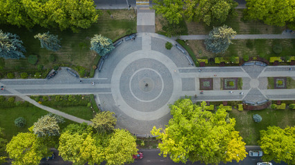 Summer aerial drone footage of city park with gardening. Top down view.