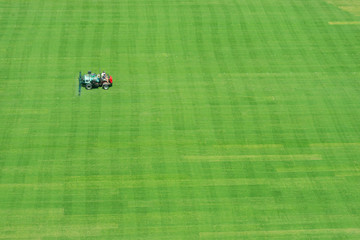 Workers are mowing a football field in Knoxville Tennessee - obrazy, fototapety, plakaty