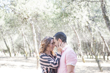 Fototapeta premium man and woman posing in the park