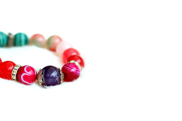 Amethyst and pink tone lucky agate stone on white wool background.Jewelry to encourages wearer's to be lucky and rich and charm.