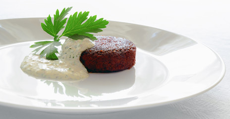 vegetable cutlet with tartar sauce decorated with parsley