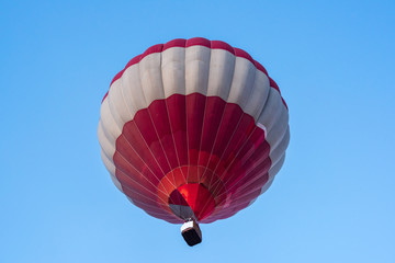 Fototapeta premium Hot air balloon under blue sky.