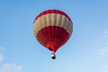 Hot air balloon under blue sky.