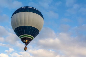 Fototapeta premium Hot air balloon under blue sky.