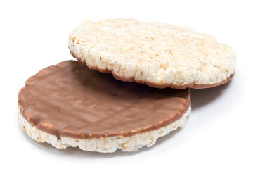 Organic chocolate covered rice cakes isolated on white background, top and bottom view