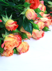 beautiful bouquet of roses on wooden table with place for text, selective focus