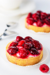 Tartlets with raspberries and a cup of tea