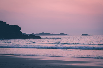 Waves hitting Porthmeor beach at dusk
