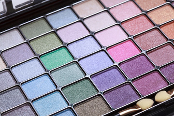 multicolored eye shadows palette on a white background