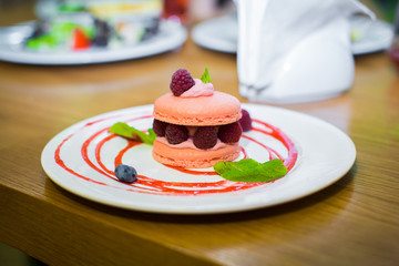 Cake with berries on white plate