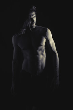 Muscular man looking away