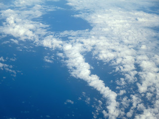 Fluffy little Clouds spread in the sky over the ocean