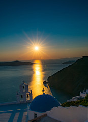 sun set over iconic blue dome