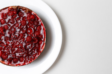 Raspberry jelly cake. Top view, flat, overhead. Copy space and text area. on white background