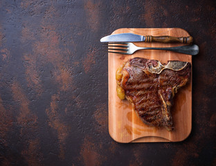 Grilled T-bone steak on dark background