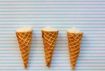 Ice cream in a cone on a blue background.
