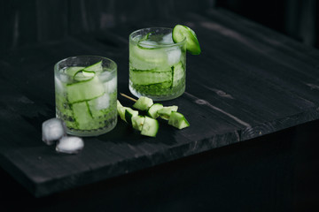 Homemade lime lemonade with cucumber. Cold beverage for hot summer day.